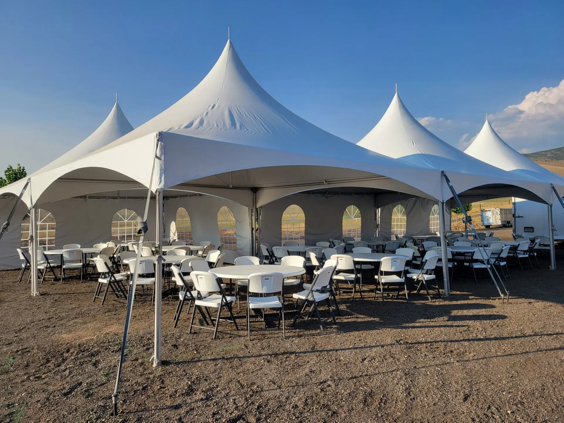 Large tent set up with chairs and tables