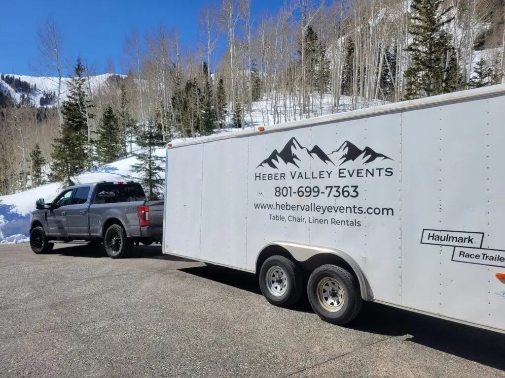 Heber Valley Events winter delivery with truck and enclosed trailer with logo on the side