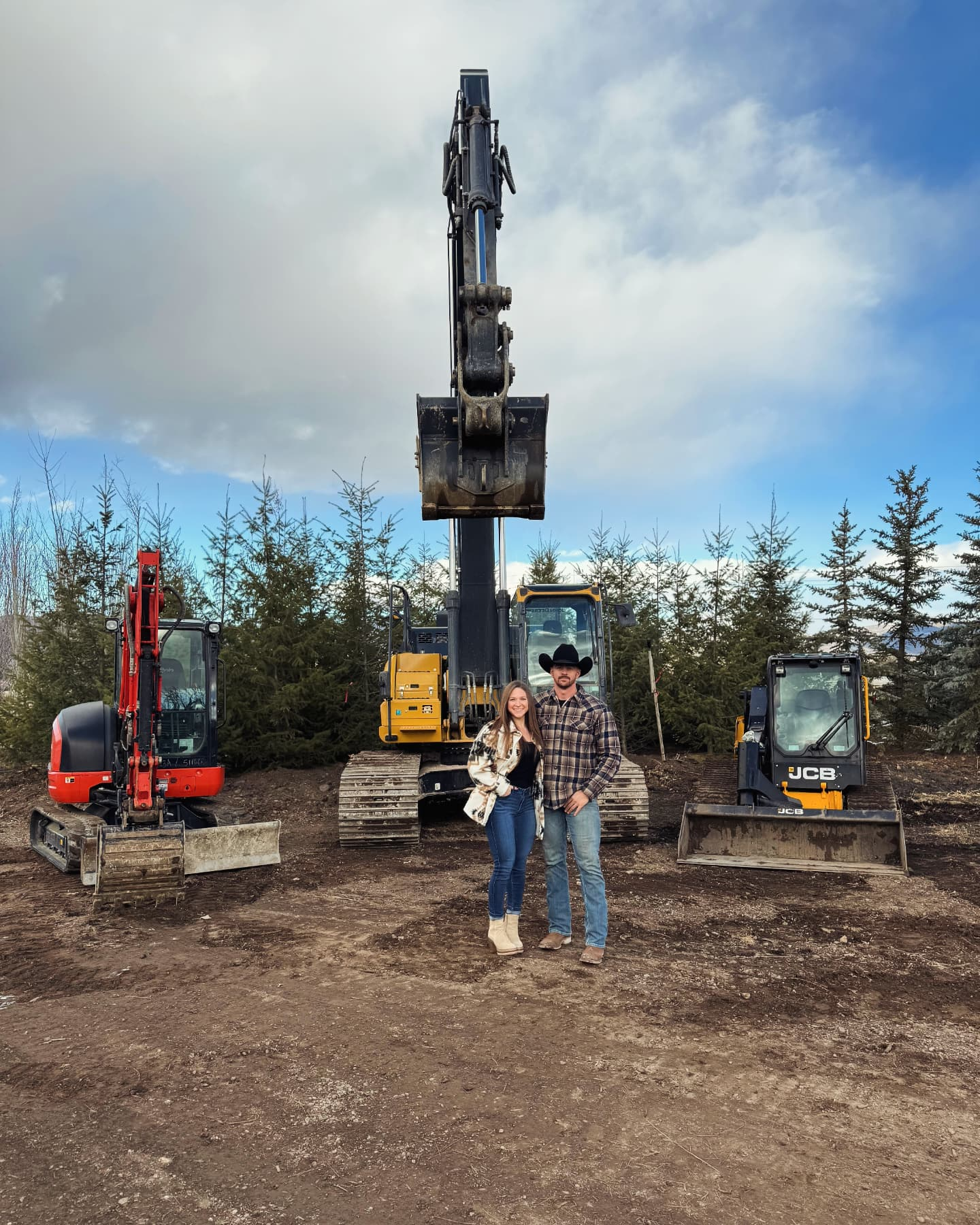 Iron Horse Equipment Rentals Owners with equipment in background