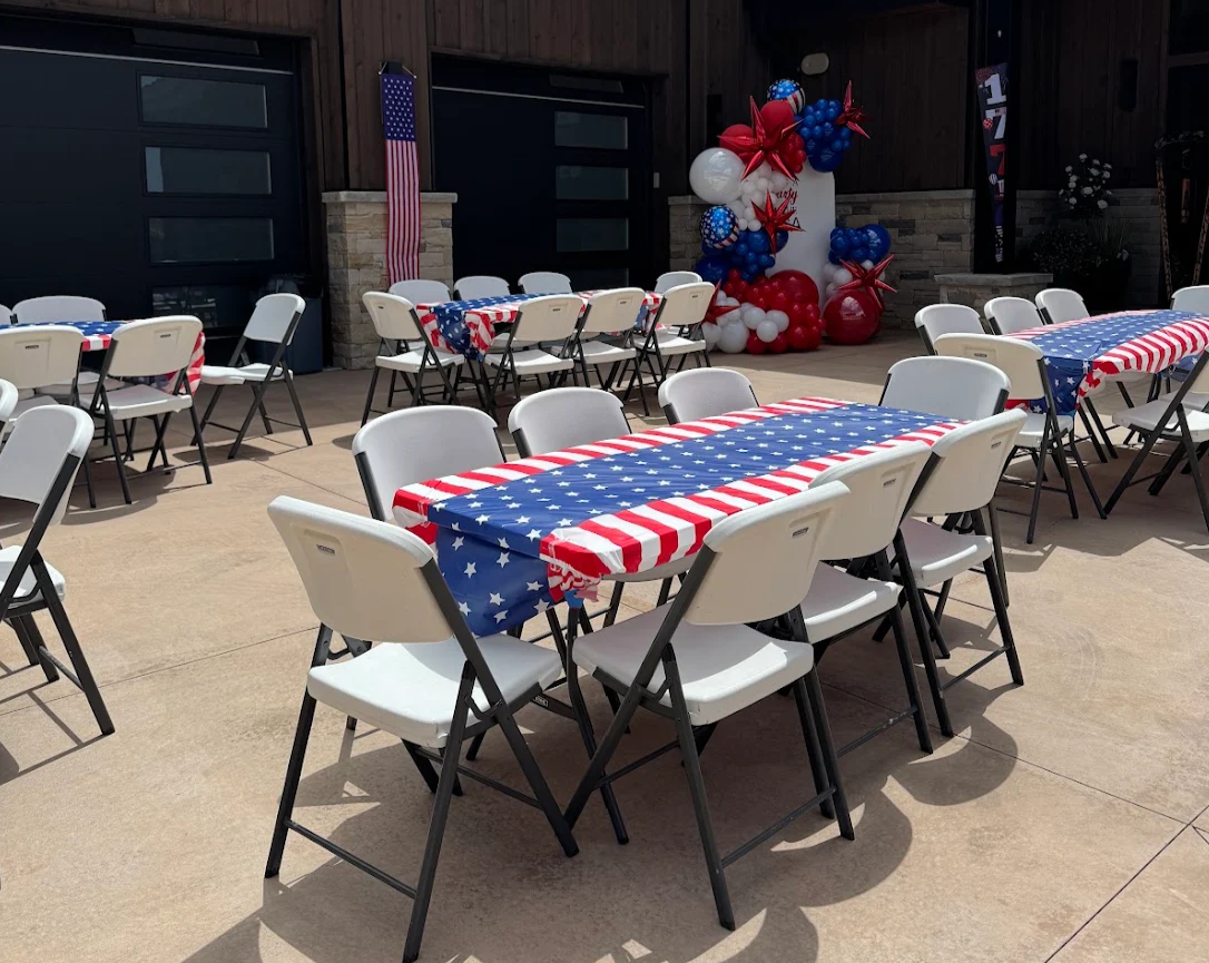 Backyard gathering with table and chair rentals